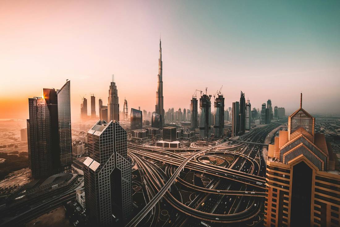 Dubai skyline glowing at sunset