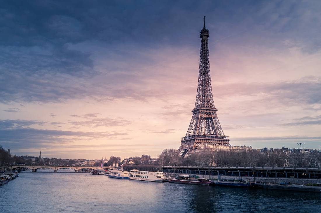 The Eiffel Tower and the Seine at dusk
