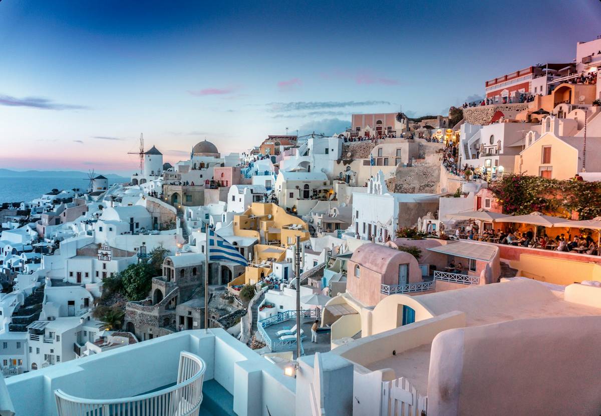 White houses of Santorini above the caldera at dusk