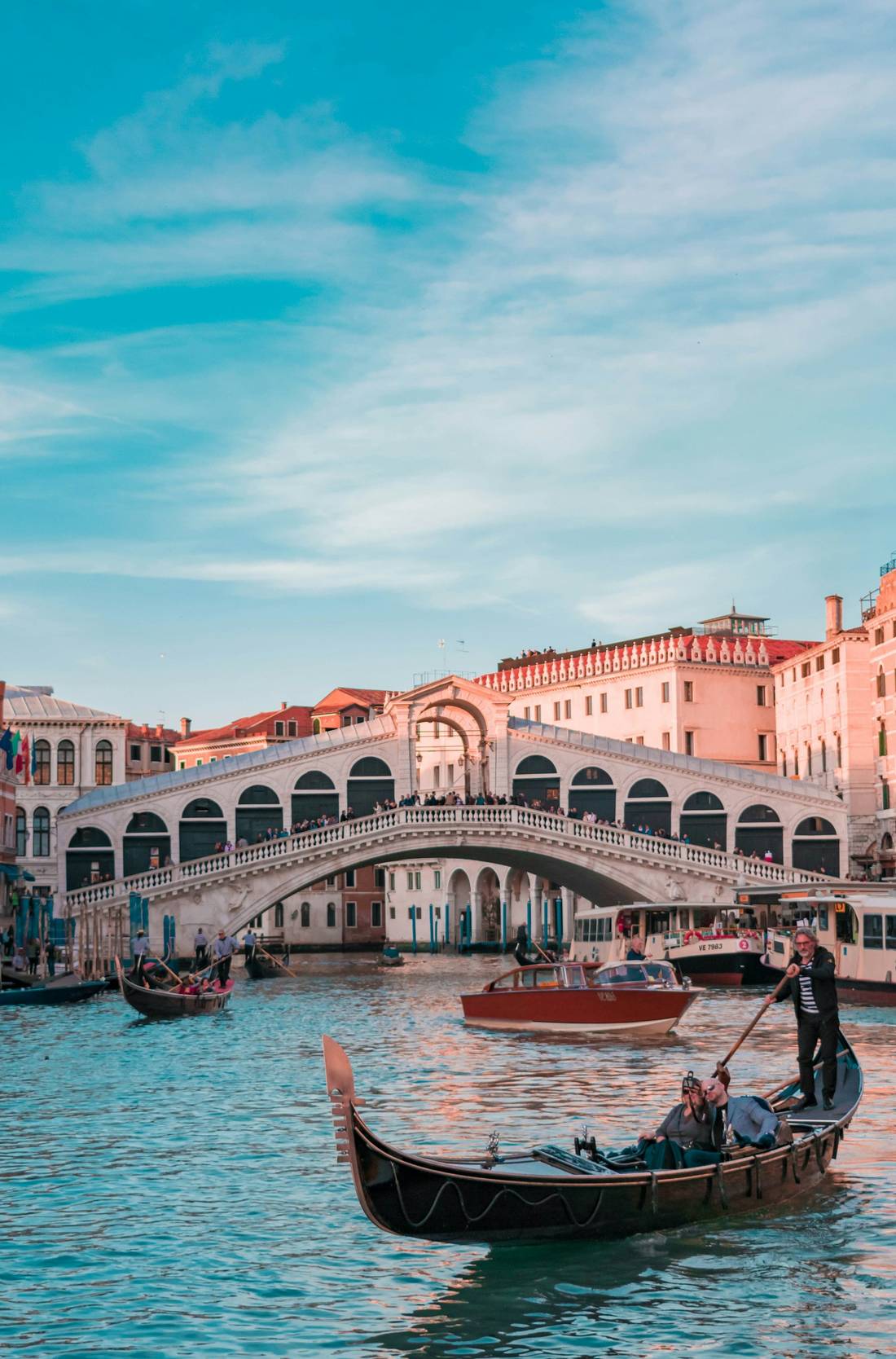 A gondola passing beneath the Rialto Bridge in Venice